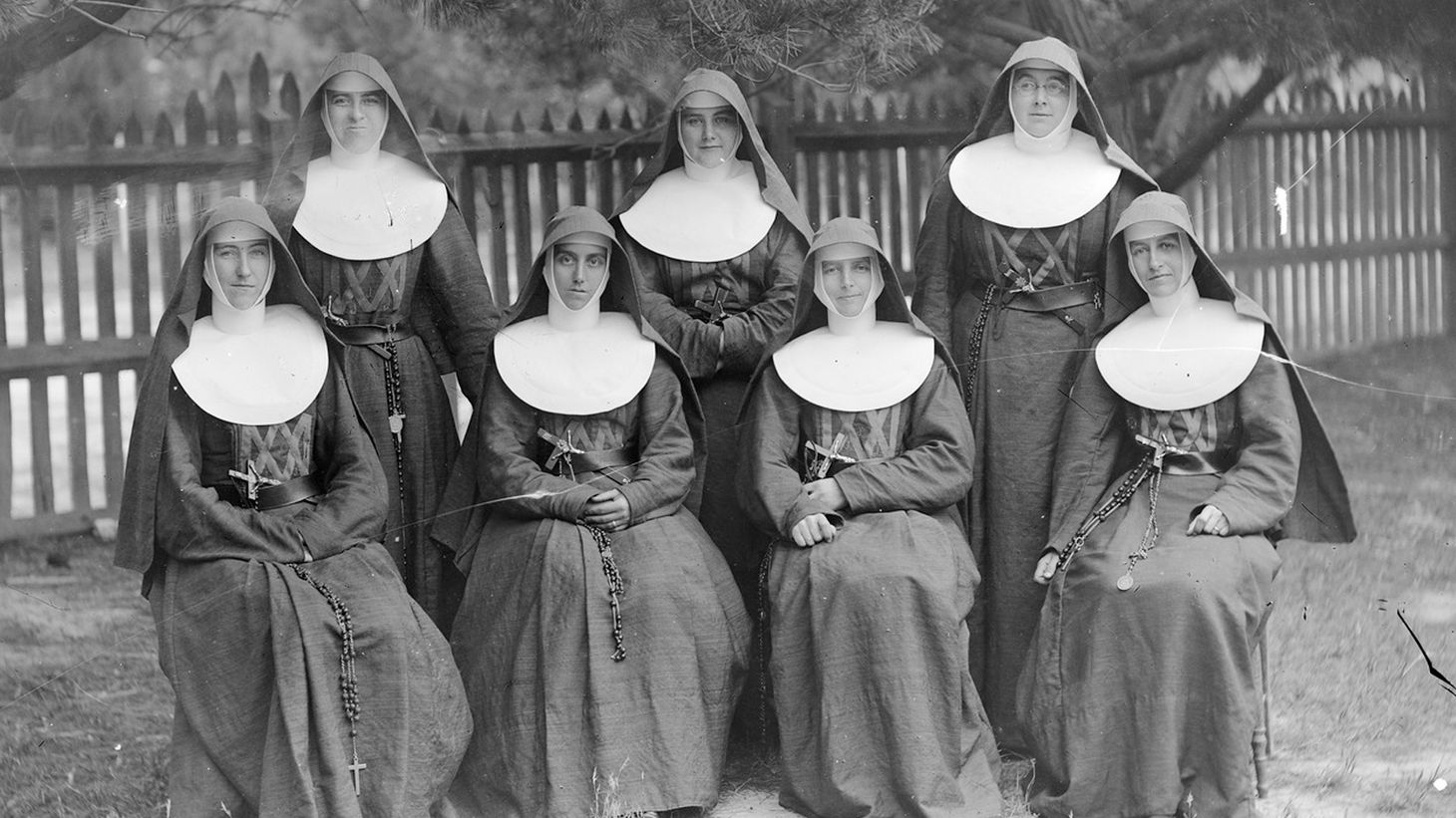 7 nuns posing for a photo. Nuns wear habits, you see – that's the link to this article.